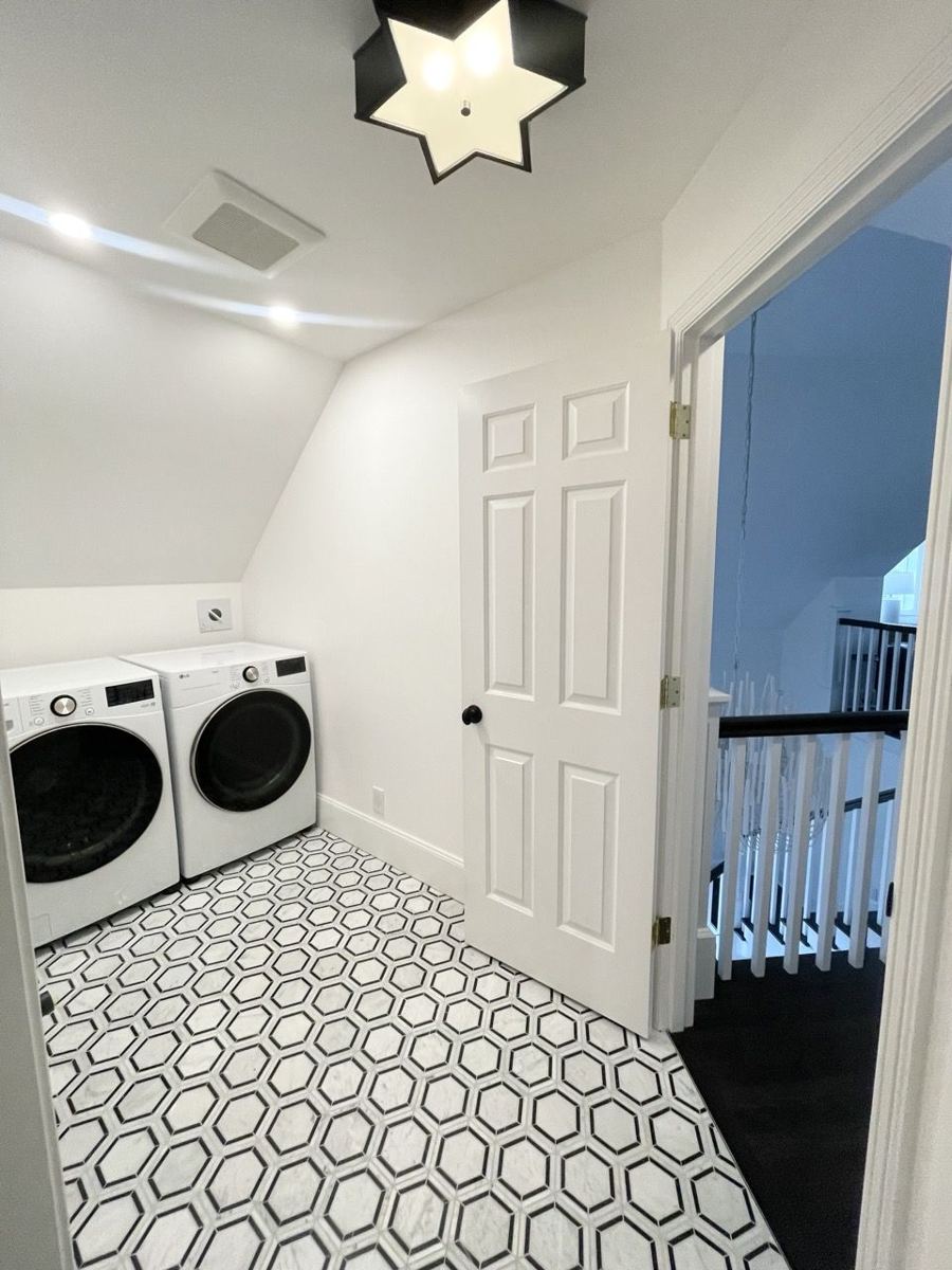 Hexagon mosaic tile floor in a laundry room