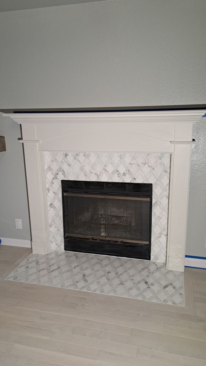 Fireplace with patterned tile surround